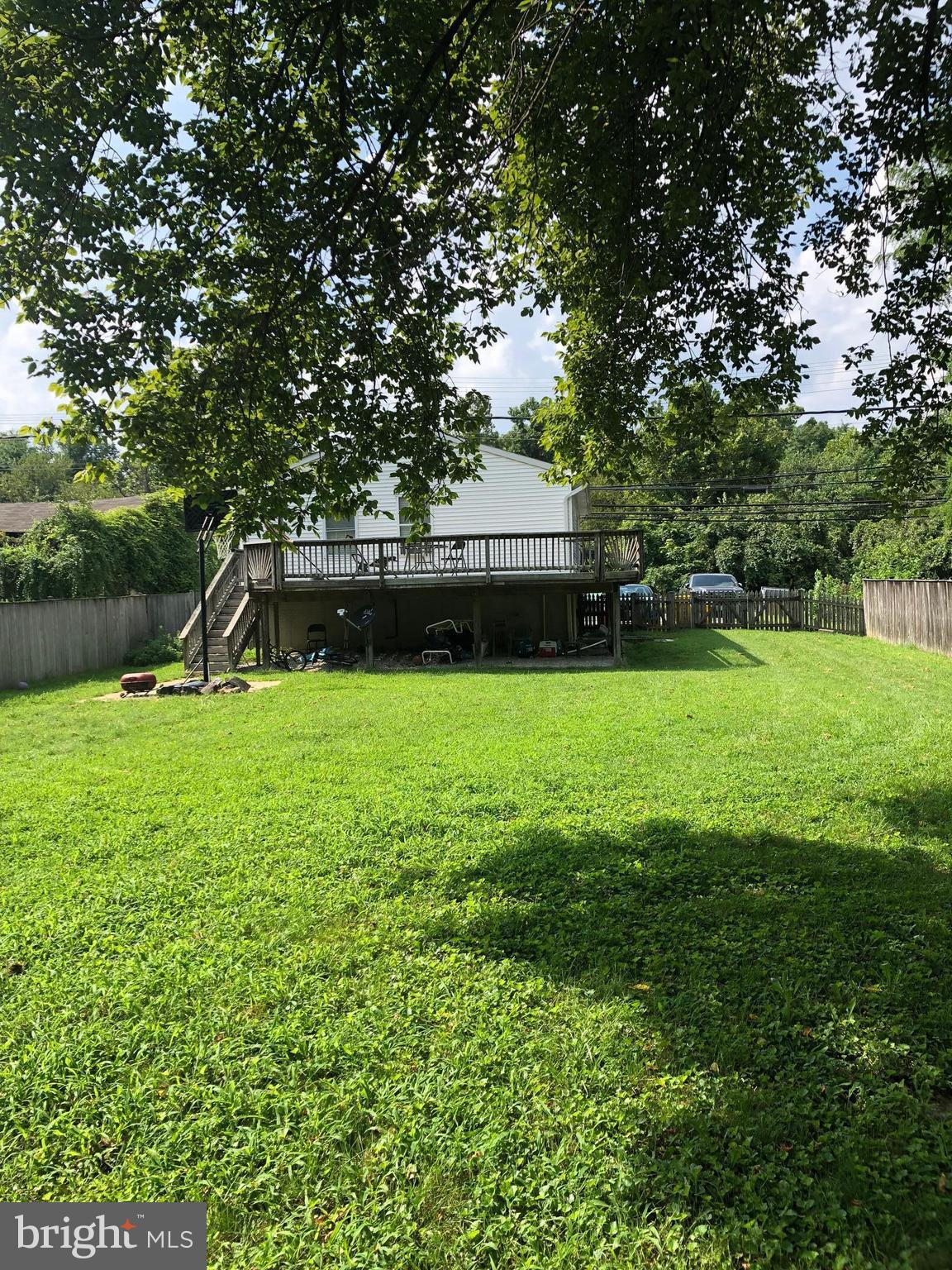 8121 Hog Neck Road Pasadena, MD 21122 - Photo 8 of 8 a view of a backyard with a garden and trees