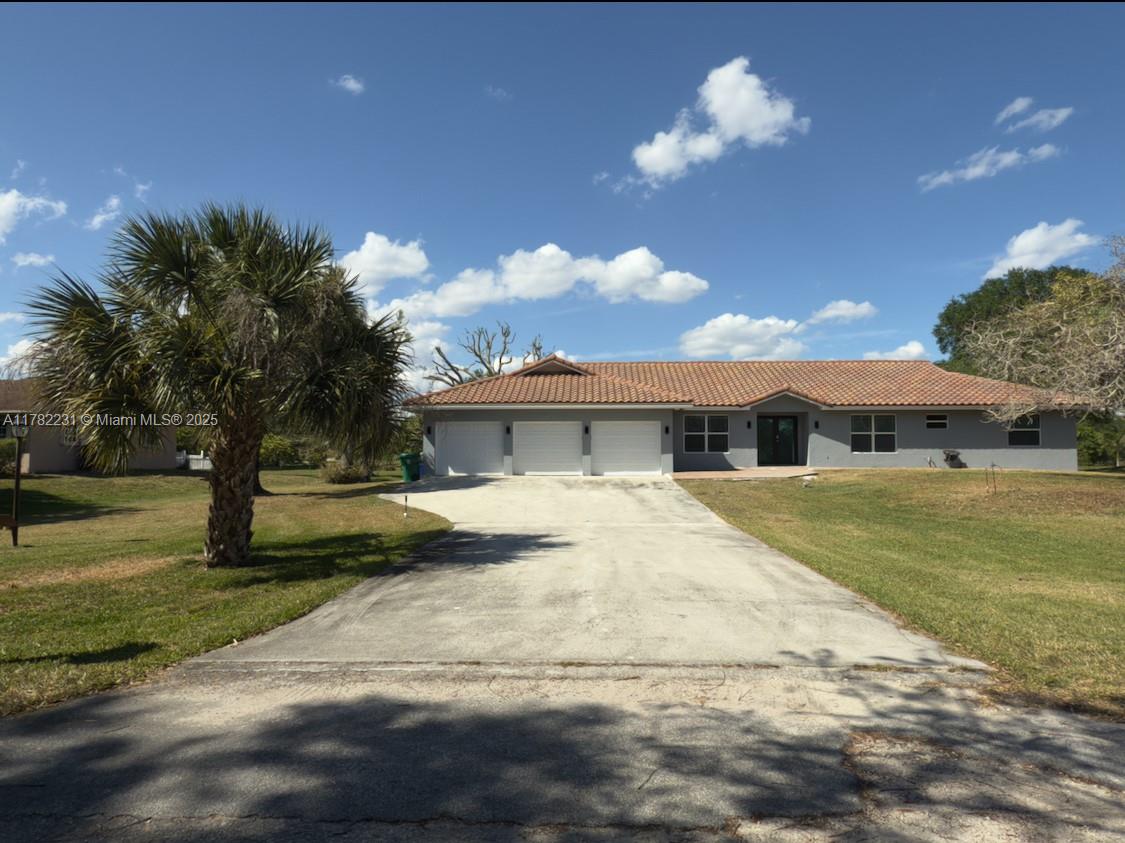 16911 Southwest 66th Street Southwest Ranches, FL 33331 - Photo 1 of 70 a view of a house with a yard