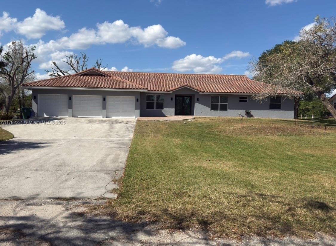 16911 Southwest 66th Street Southwest Ranches, FL 33331 - Photo 2 of 70 a view of a house with a yard