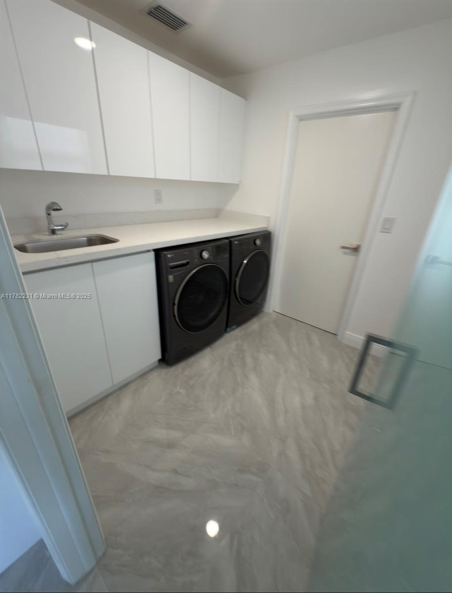 16911 Southwest 66th Street Southwest Ranches, FL 33331 - Photo 62 of 70 a utility room with dryer and washer