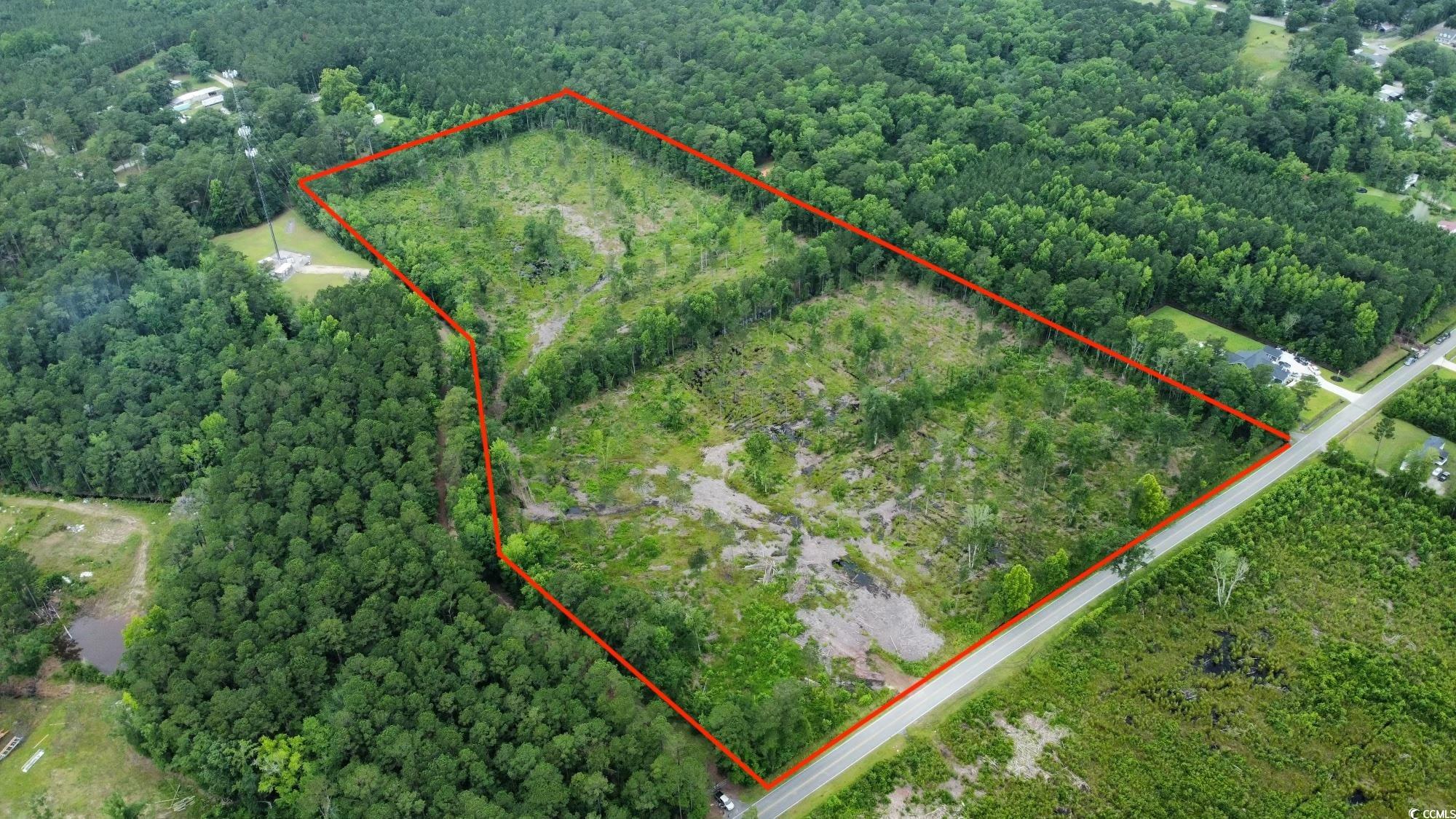 22.66 Berley Mc Road Conway, SC 29526 - Photo 1 of 7 Aerial overview of property's location featuring property parcel outlined and a heavily wooded area