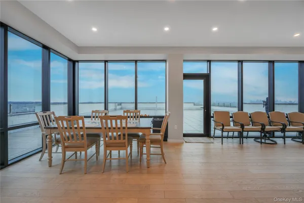a view of a dining room with furniture and window