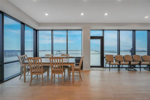 a view of a dining room with furniture and window