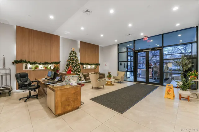 a living room with fireplace furniture and a large window