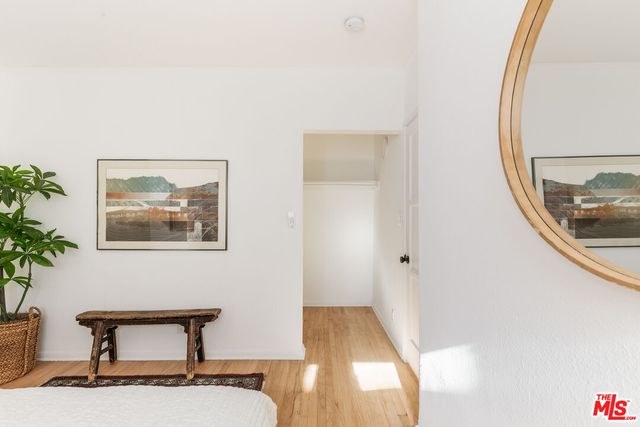 a view of a hallway with paintings on the wall