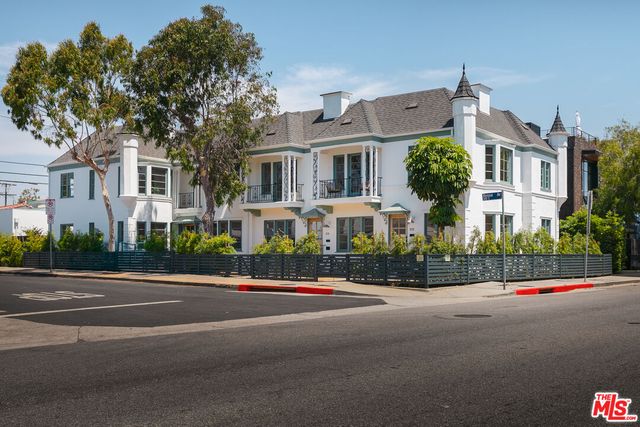 a front view of residential houses with street