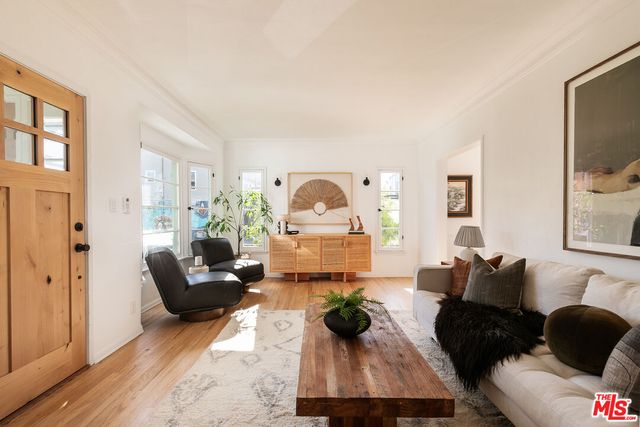 a living room with furniture and a lamp