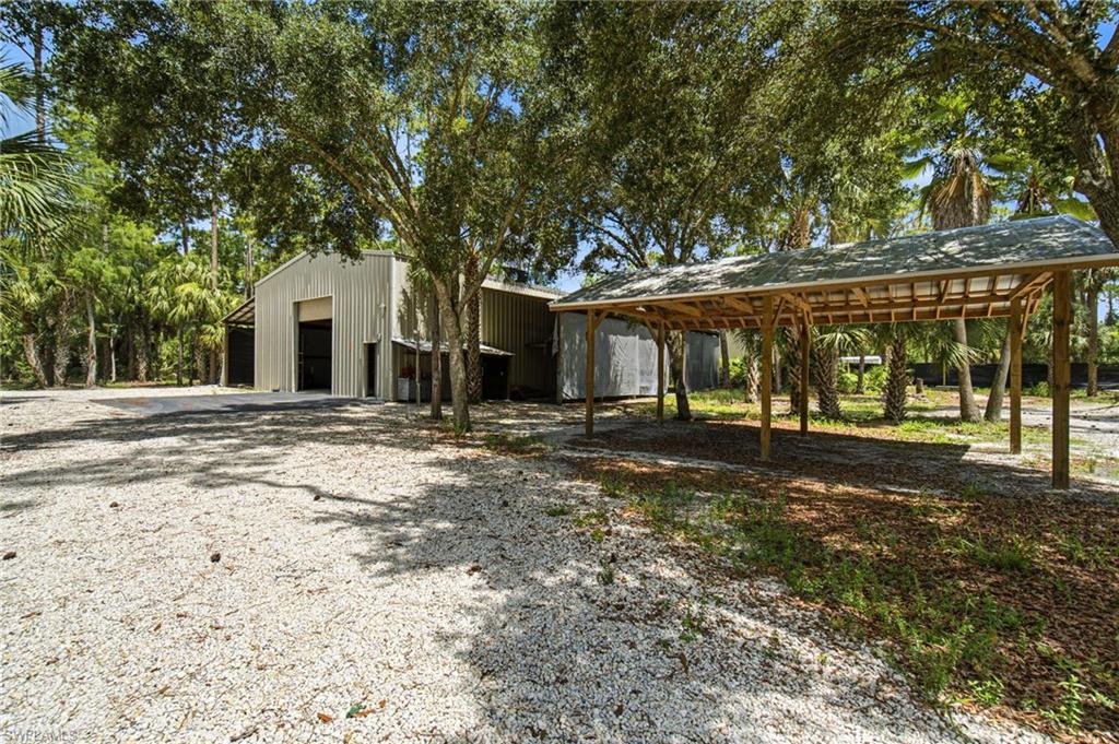 2053 17th Street Southwest Naples, FL 34117 - Photo 38 of 47 a view of a house with a yard