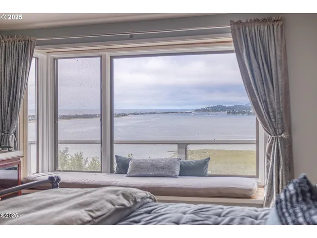 a bathroom with a toilet and a shower curtain
