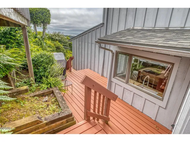 a view of a house with a yard and a garage