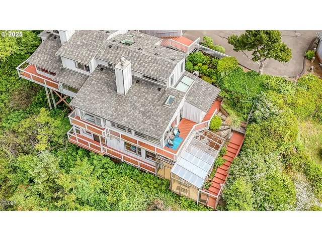 a aerial view of a house with a yard