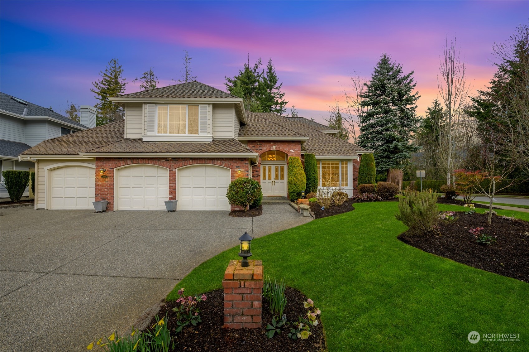 3019 213th Street Southeast Bothell, WA 98021 - Photo 1 of 32 a front view of a house with garden