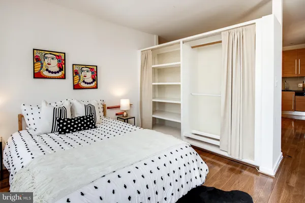 a bedroom with a bed and a window