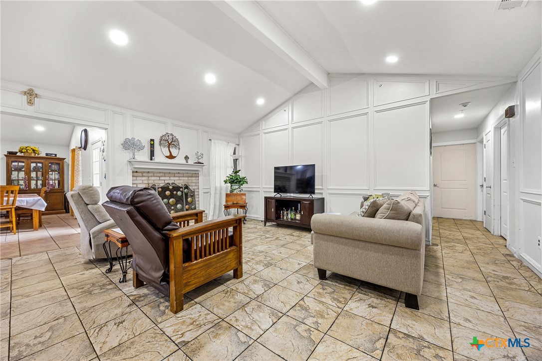 15309 Delahunty Lane Pflugerville, TX 78660 - Photo 21 of 35 a living room with furniture and a flat screen tv