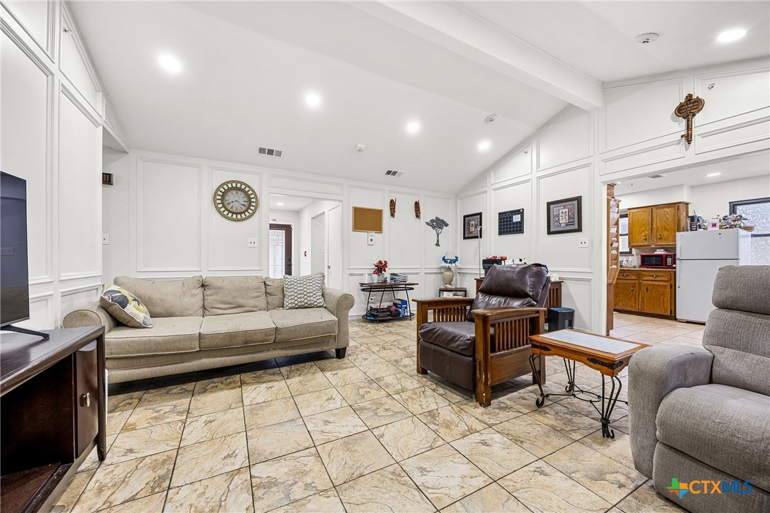 15309 Delahunty Lane Pflugerville, TX 78660 - Photo 22 of 35 a living room with furniture and wooden floor