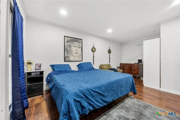 a bed room with a bed and a painting