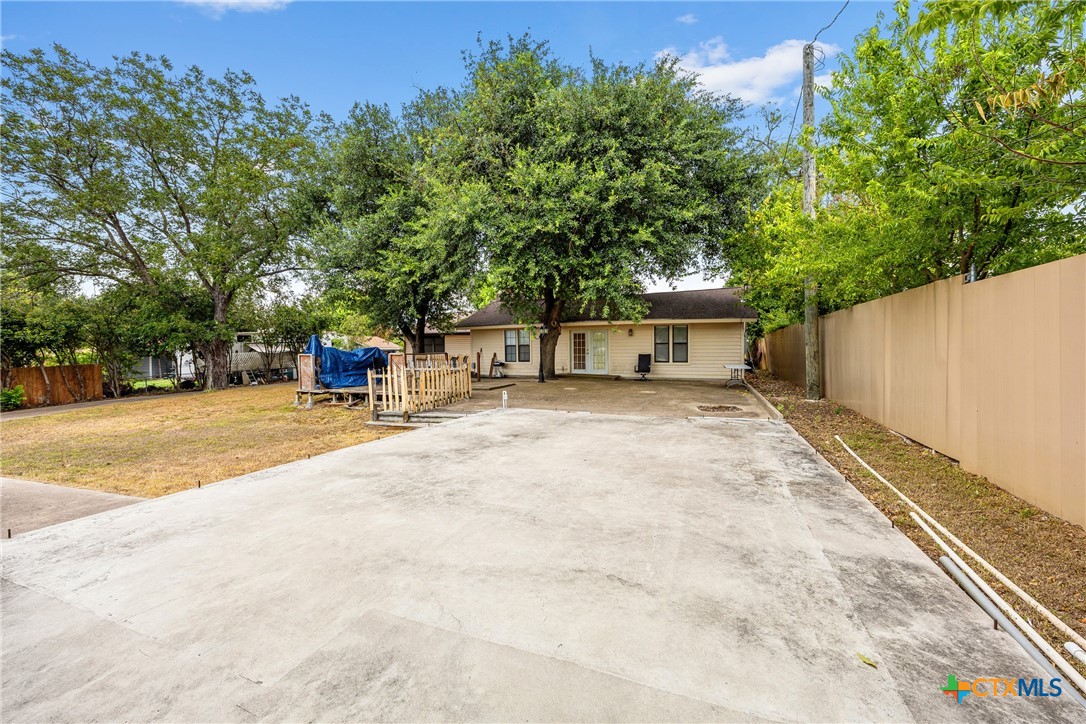 15309 Delahunty Lane Pflugerville, TX 78660 - Photo 3 of 35 a view of street with a bench and trees
