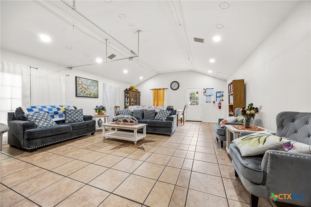 15309 Delahunty Lane Pflugerville, TX 78660 - Photo 31 of 35 a living room with furniture and a large window