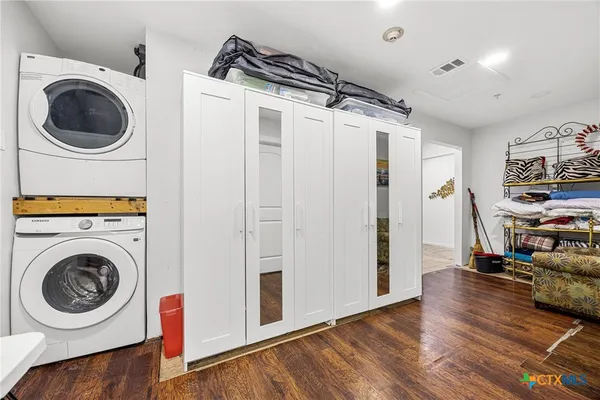 a view of a storage and utility room with washer and dryer