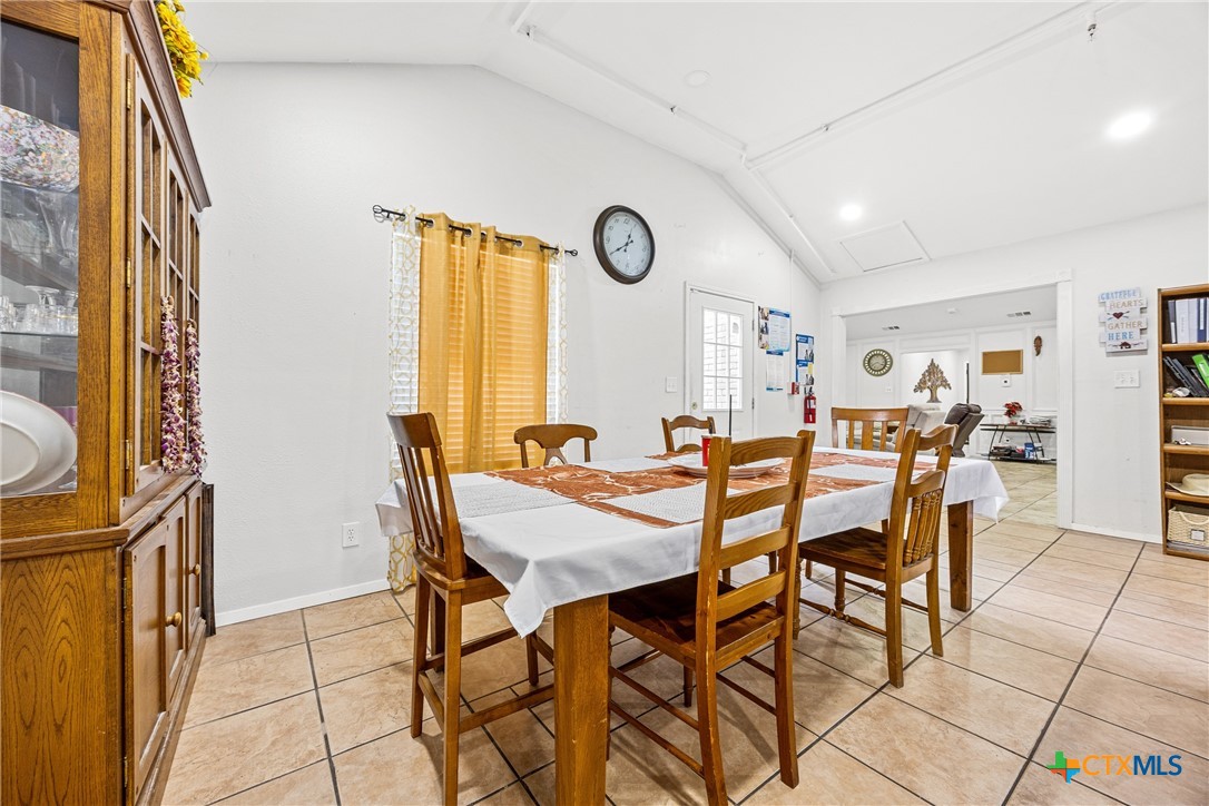 15309 Delahunty Lane Pflugerville, TX 78660 - Photo 9 of 35 a view of a dining room with furniture and a window
