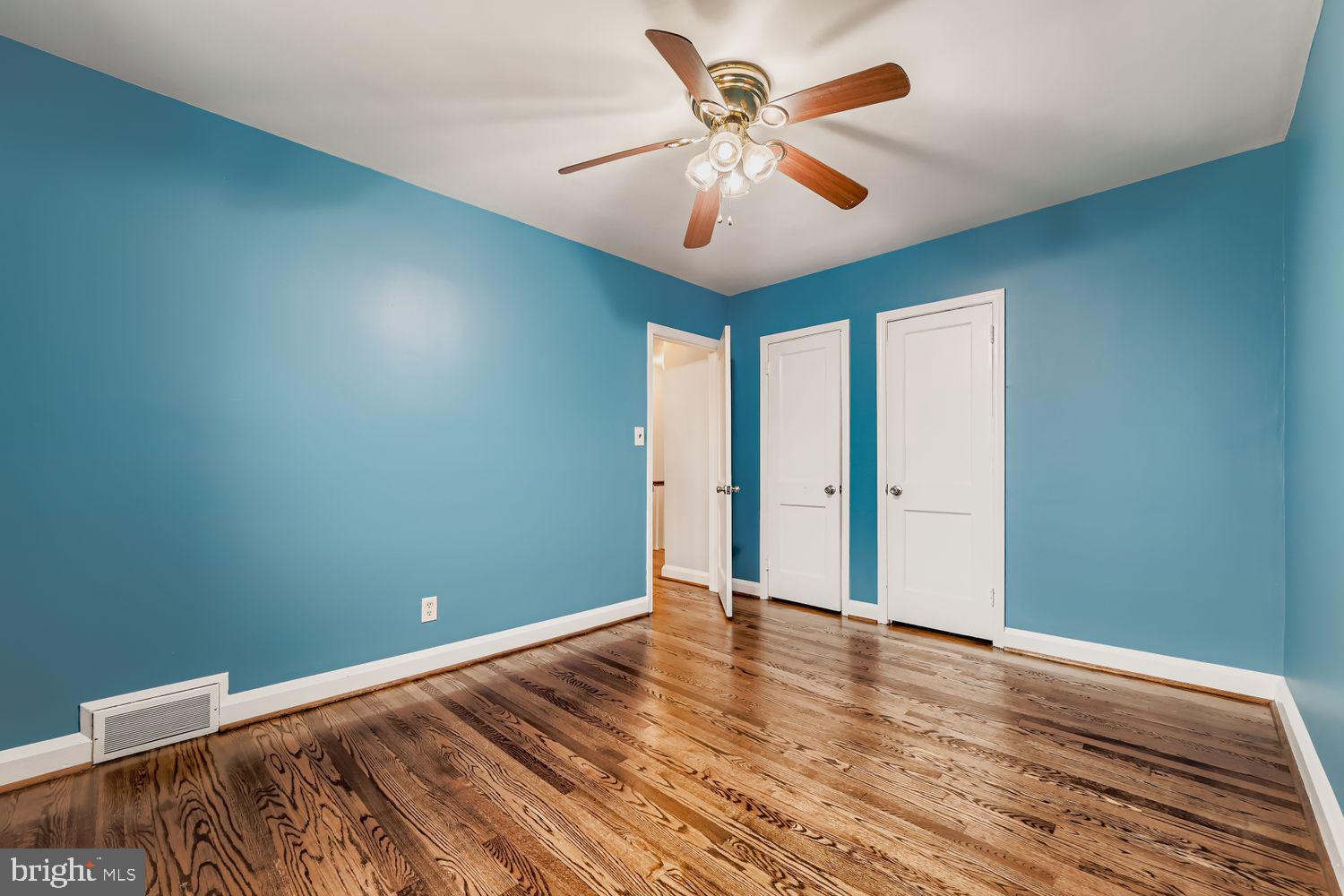 8119 Kirkwall Court Towson, MD 21286 - Photo 20 of 39 an empty room with wooden floor and windows