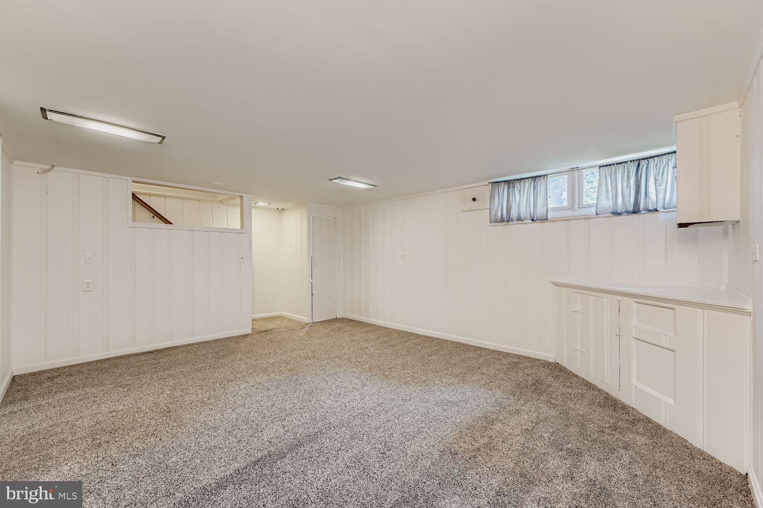 8119 Kirkwall Court Towson, MD 21286 - Photo 23 of 39 a view of an empty room with a kitchen