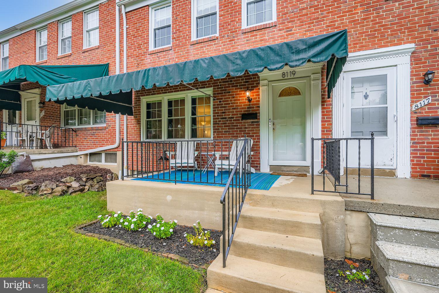 8119 Kirkwall Court Towson, MD 21286 - Photo 4 of 39 a view of a building with a garden and bench