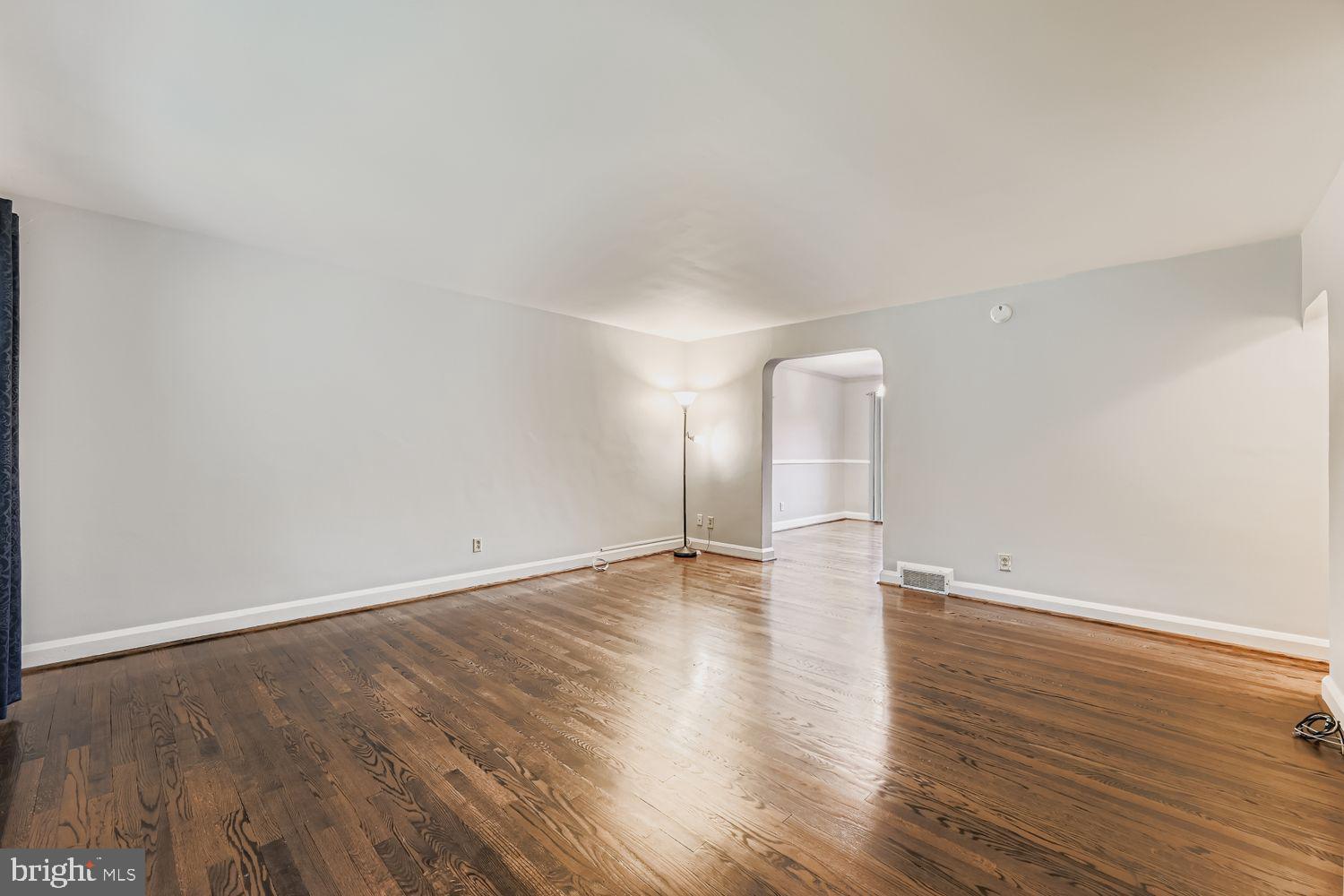 8119 Kirkwall Court Towson, MD 21286 - Photo 8 of 39 a view of an empty room with wooden floor