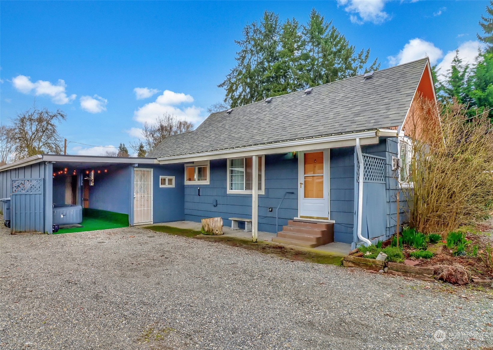 3903 Freeman Road East Edgewood, WA 98371 - Photo 1 of 40 a view of a house with a yard and garage