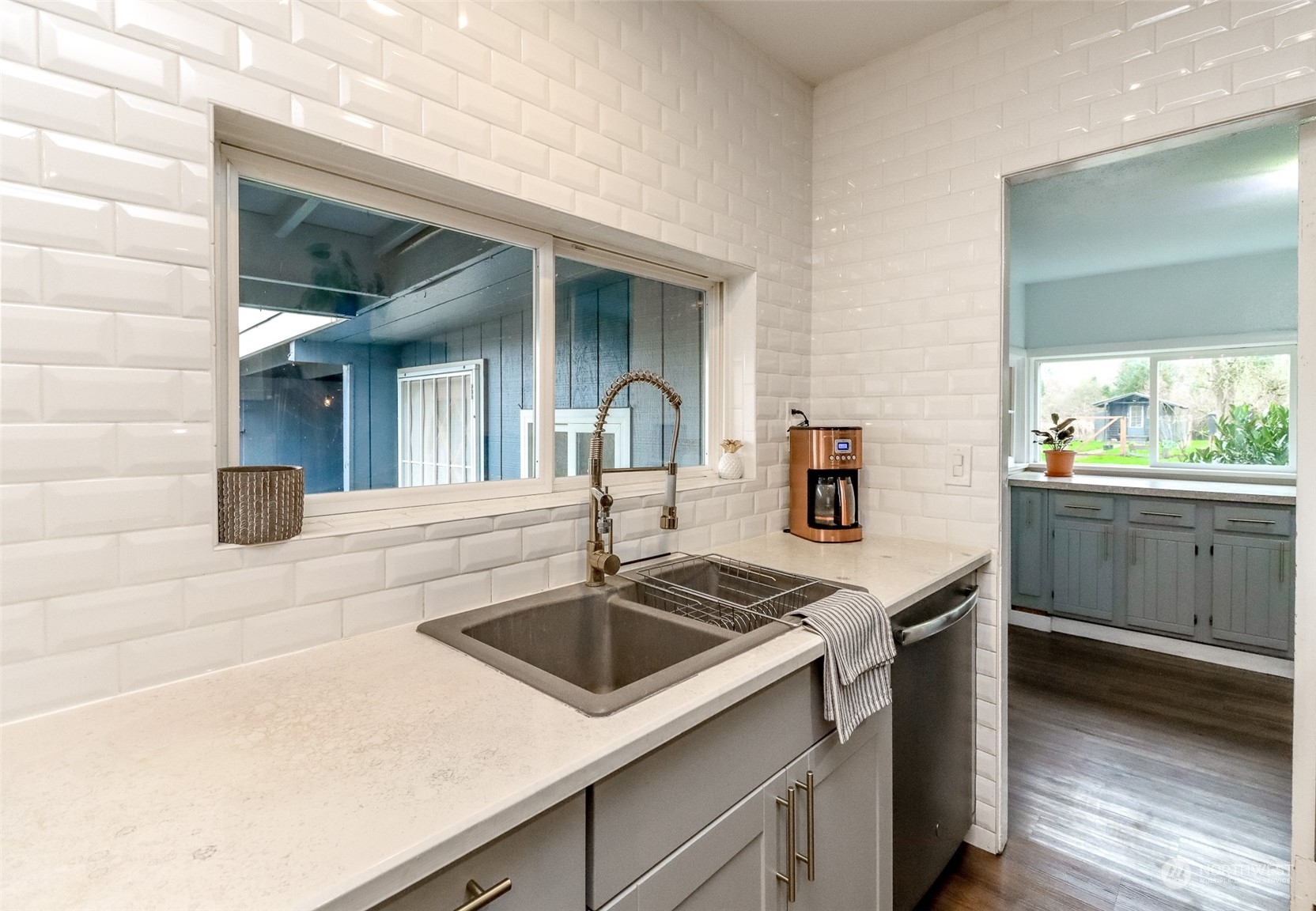 3903 Freeman Road East Edgewood, WA 98371 - Photo 12 of 40 a kitchen that has a sink and a stove