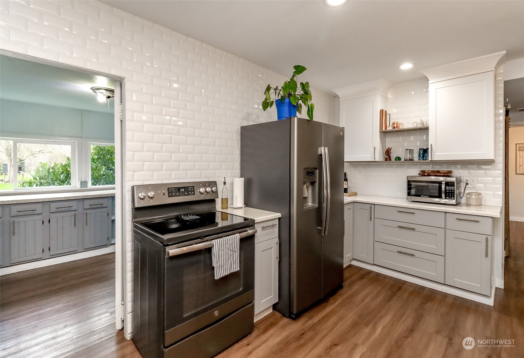3903 Freeman Road East Edgewood, WA 98371 - Photo 14 of 40 a kitchen with a white stove top oven and refrigerator