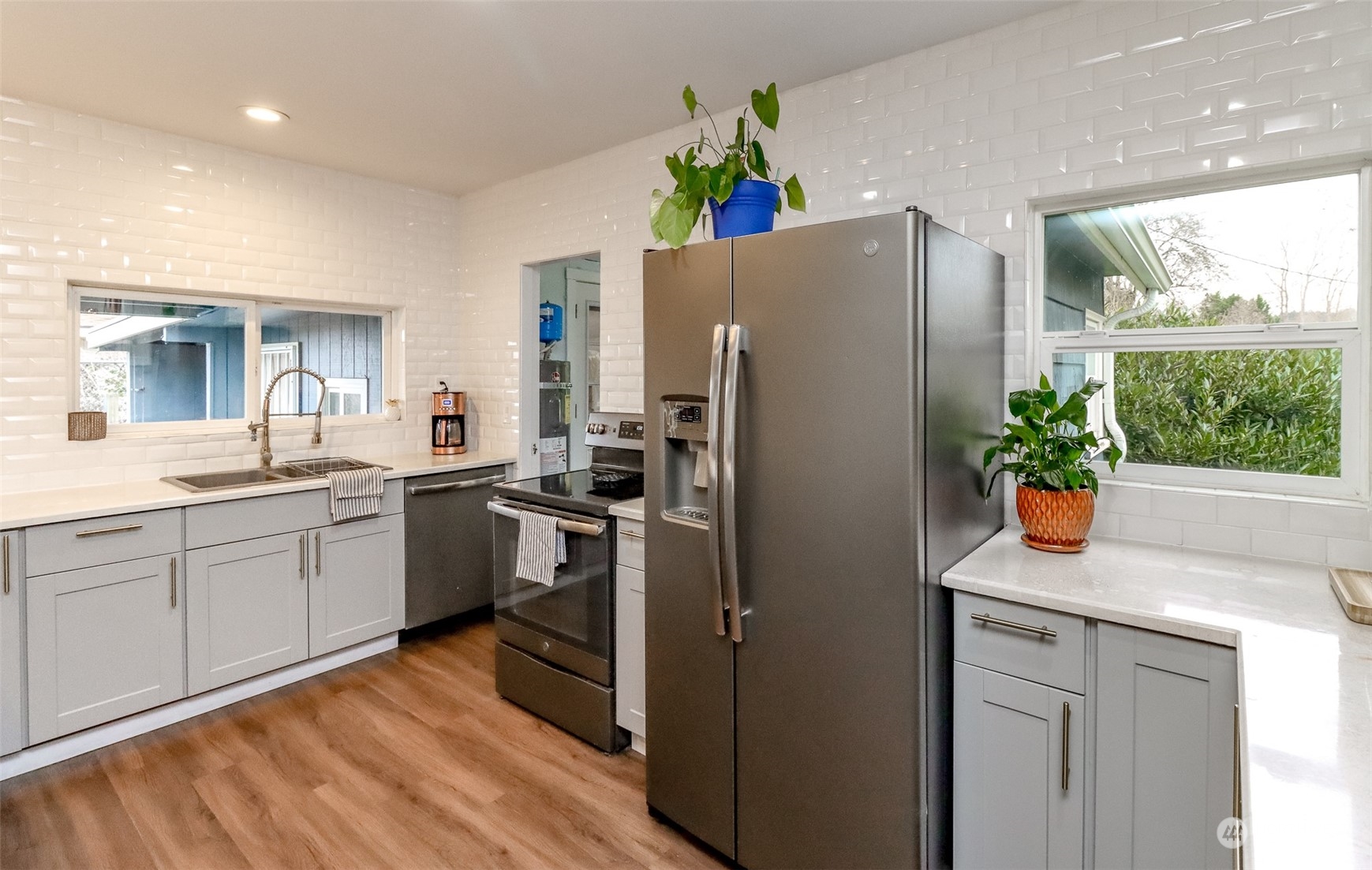 3903 Freeman Road East Edgewood, WA 98371 - Photo 15 of 40 a kitchen with a refrigerator and a sink