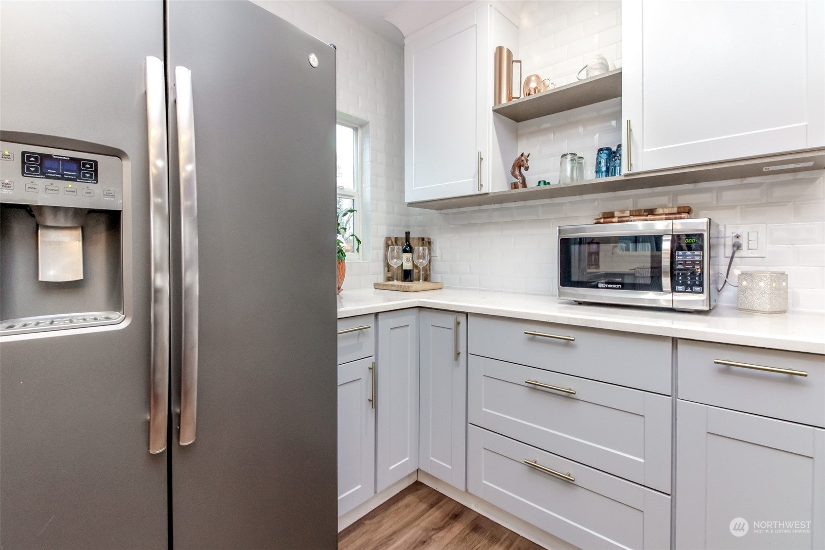 3903 Freeman Road East Edgewood, WA 98371 - Photo 16 of 40 a kitchen with stainless steel appliances cabinets and a potted plant