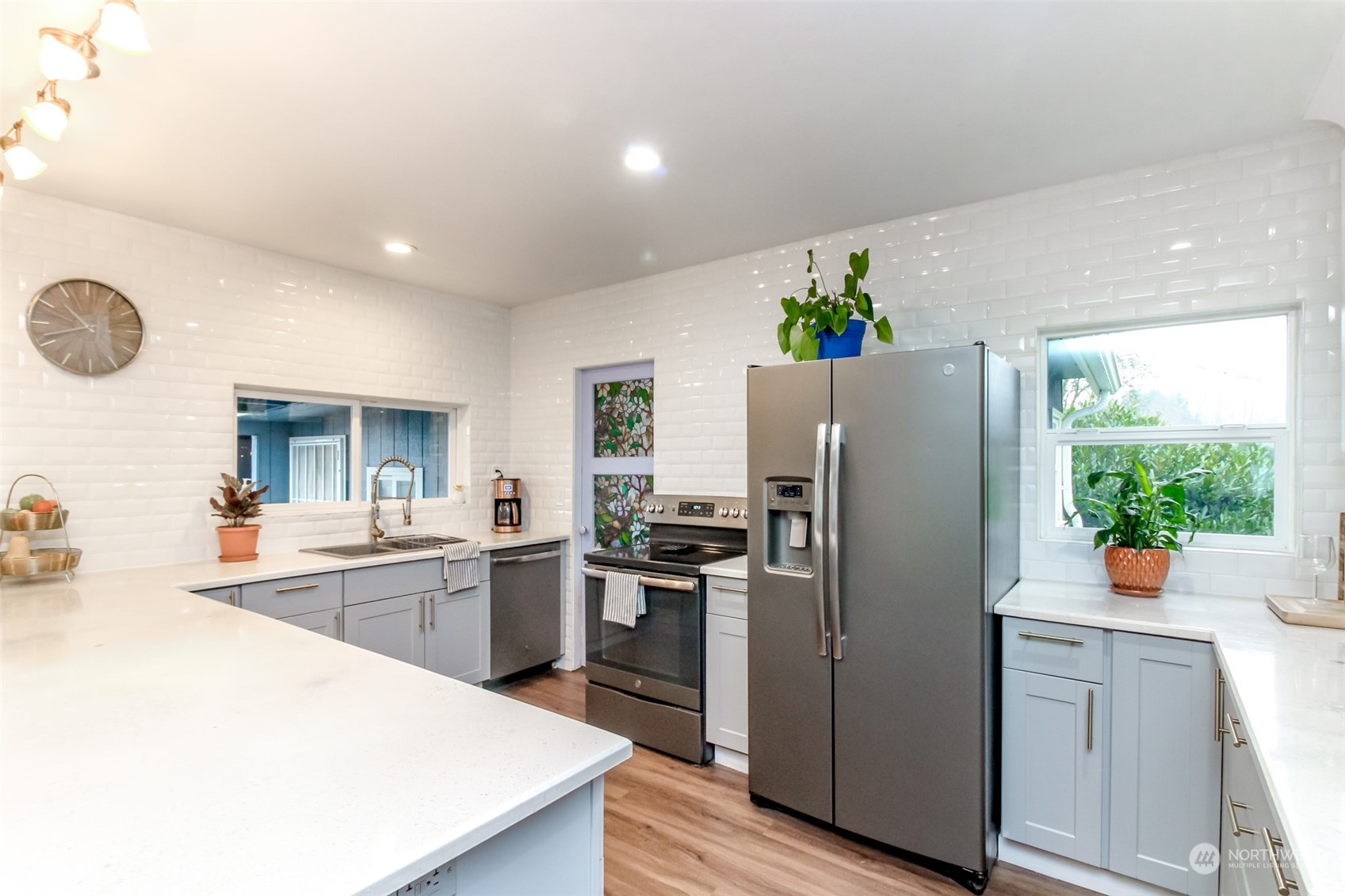 3903 Freeman Road East Edgewood, WA 98371 - Photo 18 of 40 a kitchen with a refrigerator and a sink