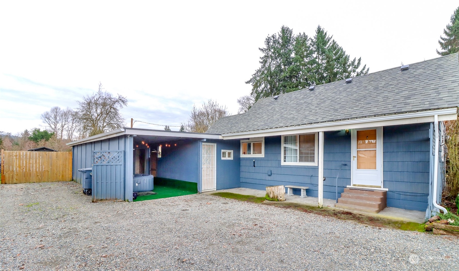 3903 Freeman Road East Edgewood, WA 98371 - Photo 2 of 40 a front view of a house with a yard and garage