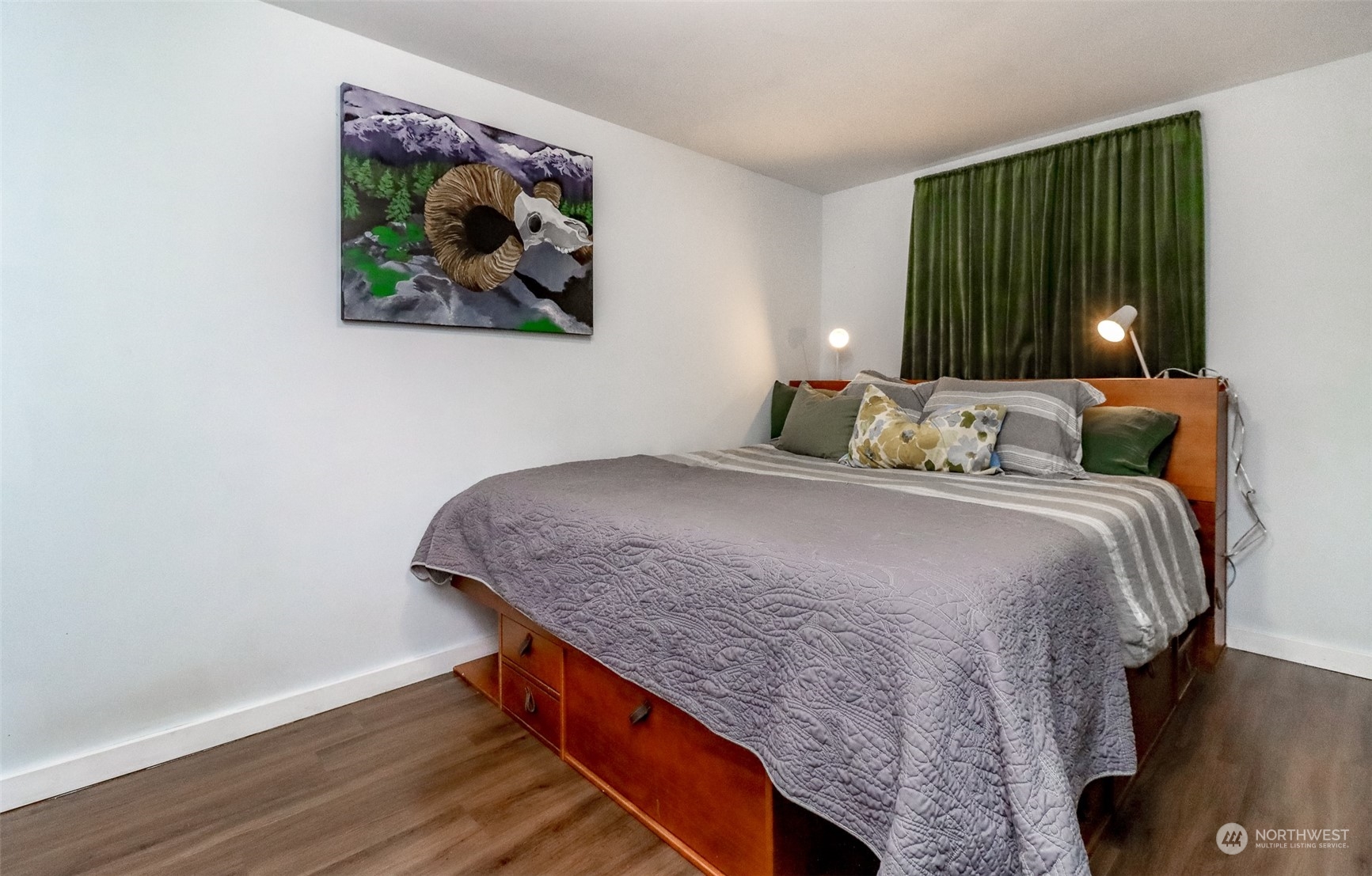 3903 Freeman Road East Edgewood, WA 98371 - Photo 21 of 40 a bedroom with a bed and a painting on the wall