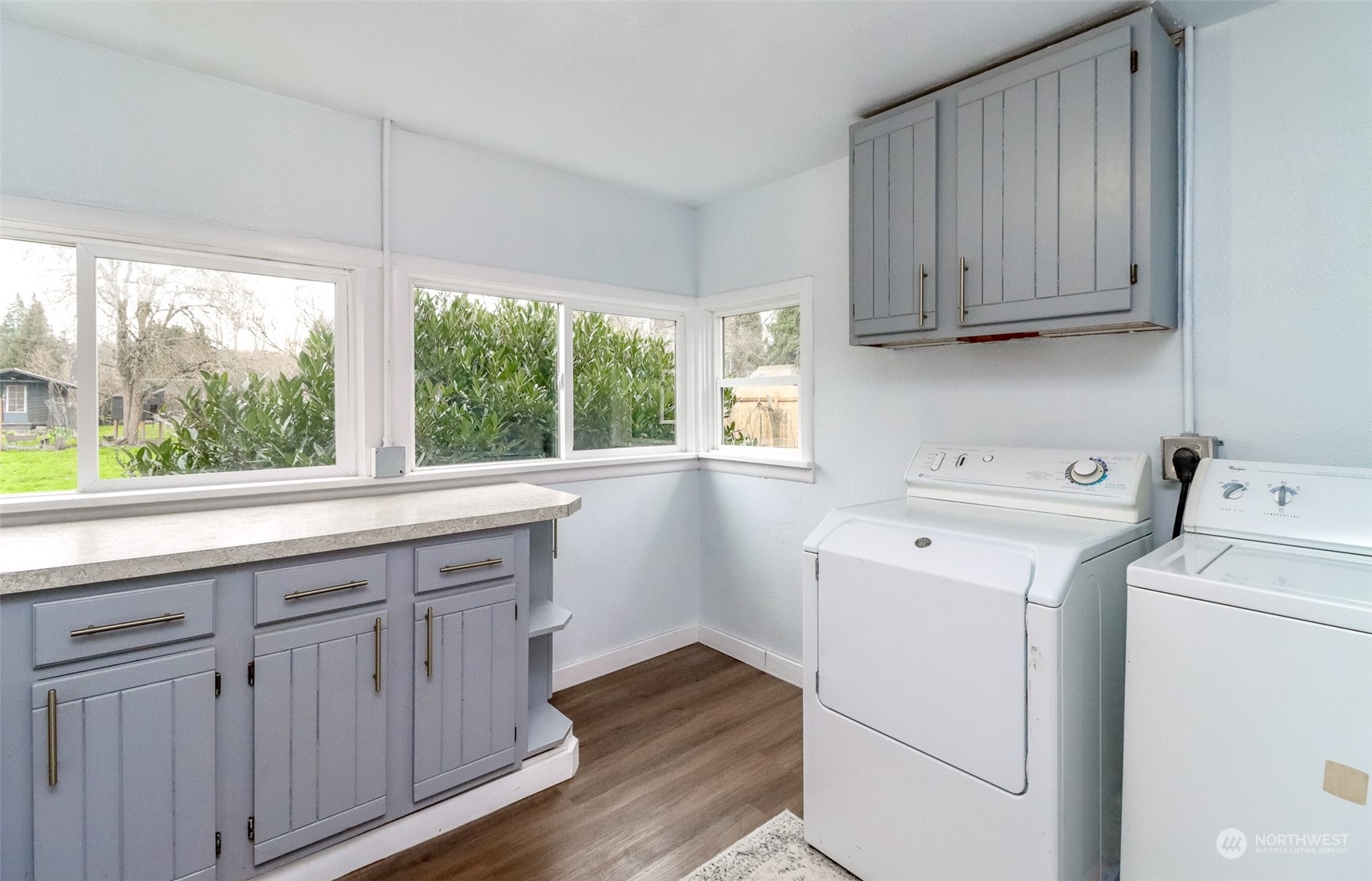 3903 Freeman Road East Edgewood, WA 98371 - Photo 29 of 40 a view of a kitchen with wooden cabinet and a window