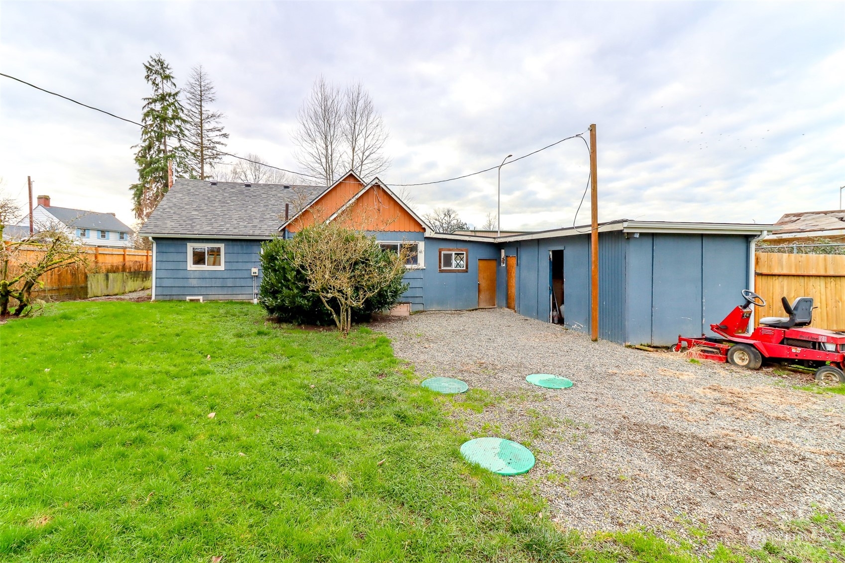 3903 Freeman Road East Edgewood, WA 98371 - Photo 40 of 40 a front view of a house with a yard and garage