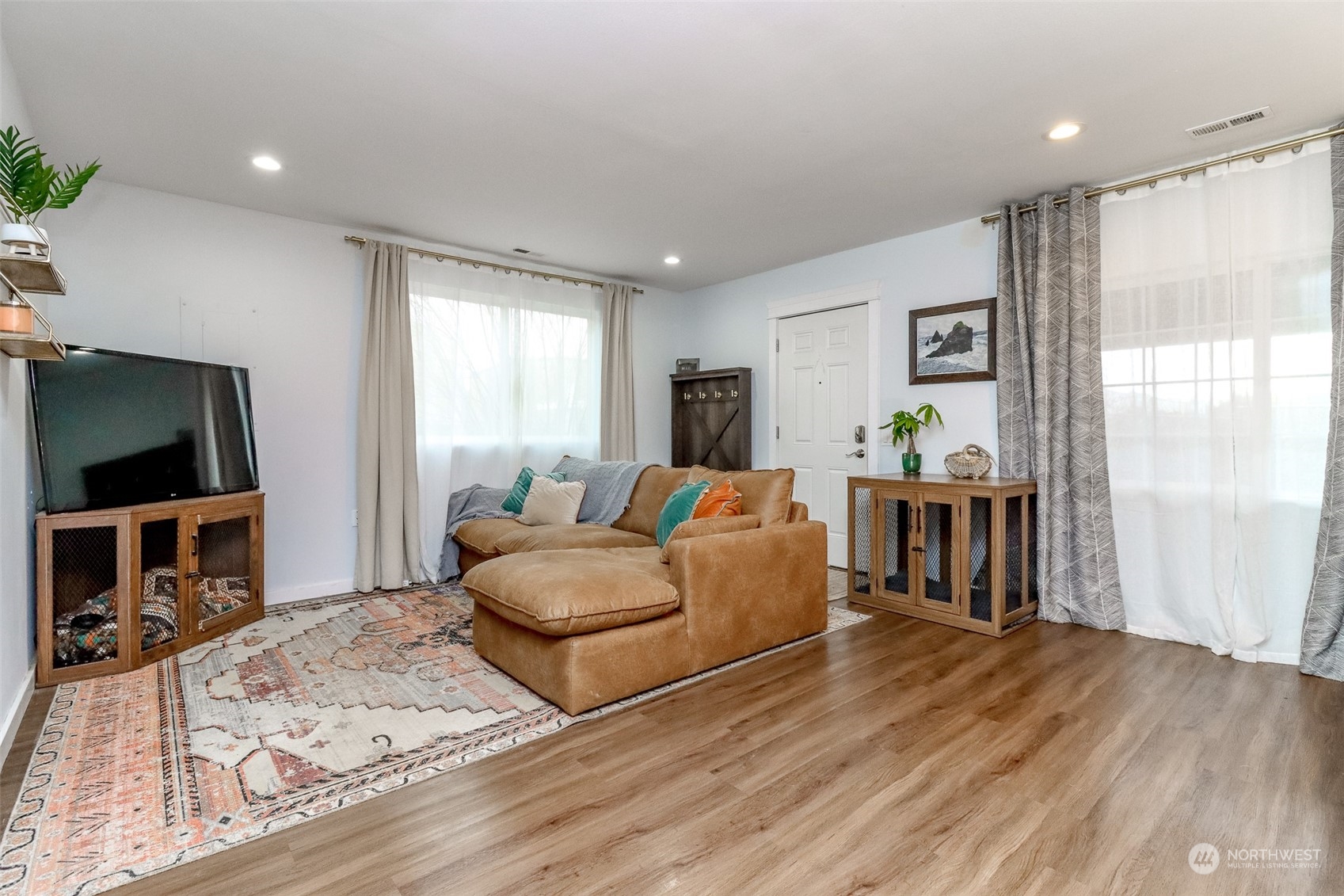 3903 Freeman Road East Edgewood, WA 98371 - Photo 5 of 40 a living room with furniture and a flat screen tv