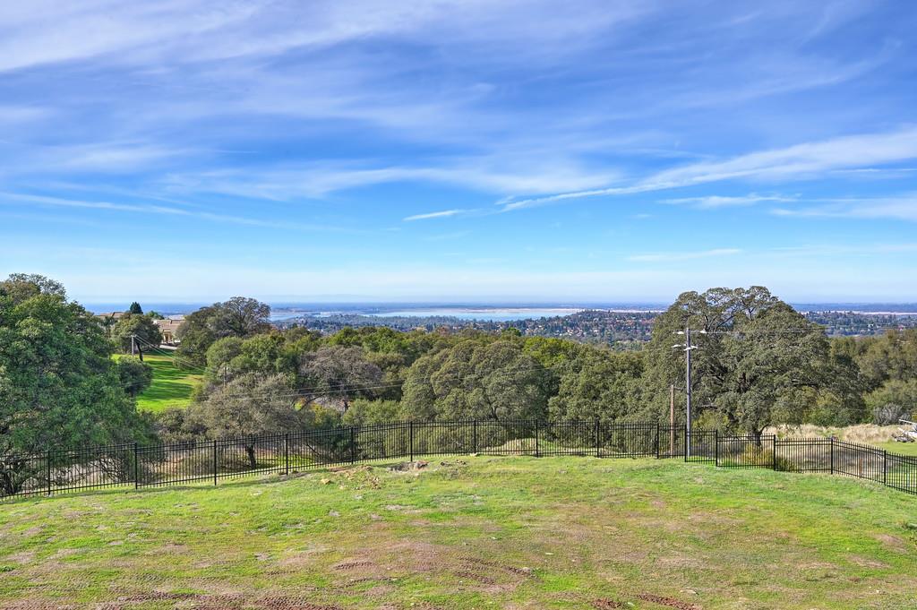 2040 West Green Springs Road El Dorado Hills, CA 95762 - Photo 15 of 24 a view of a grassy field with an trees