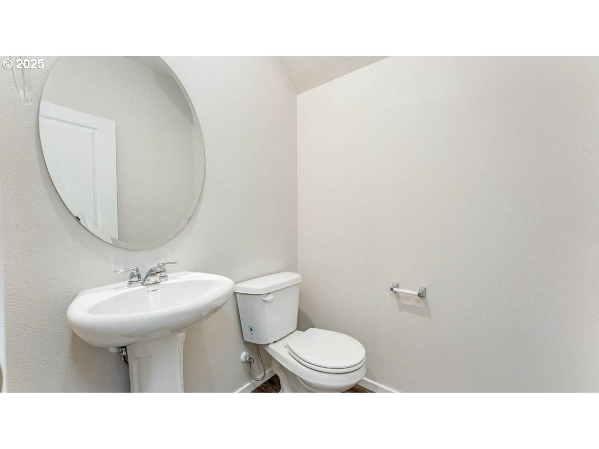 2975 T Street Springfield, OR 97477 - Photo 3 of 28 a bathroom with a sink toilet and mirror