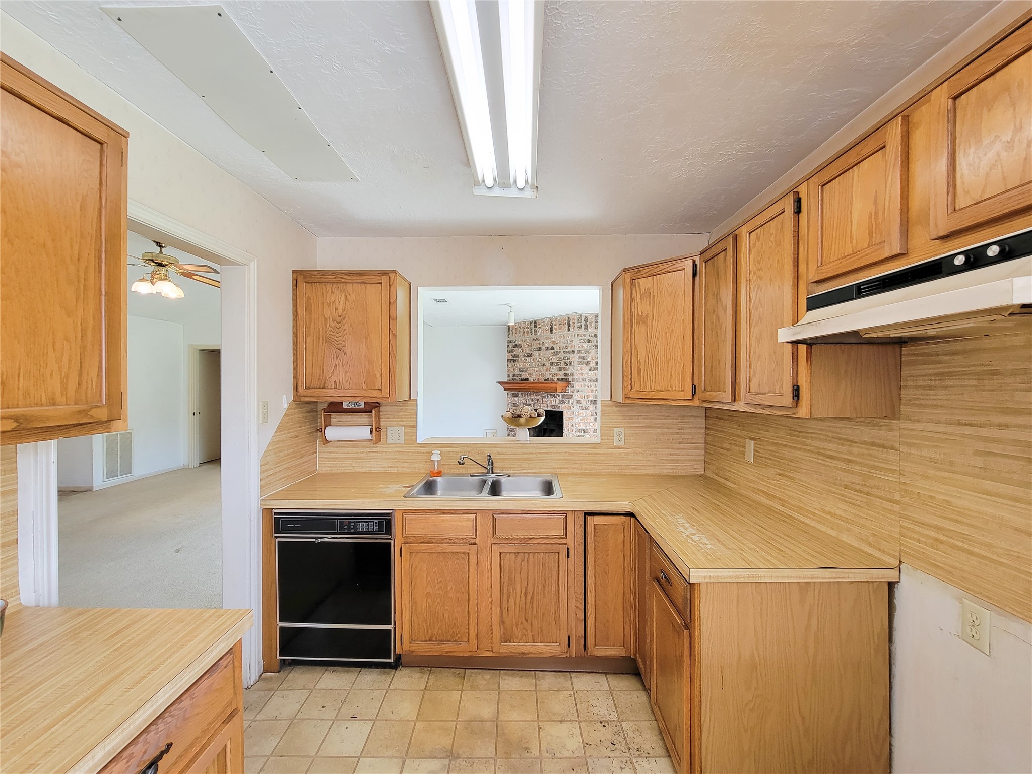 23211 Timberbrook Drive Spring, TX 77373 - Photo 15 of 34 a kitchen with a sink stove and cabinets