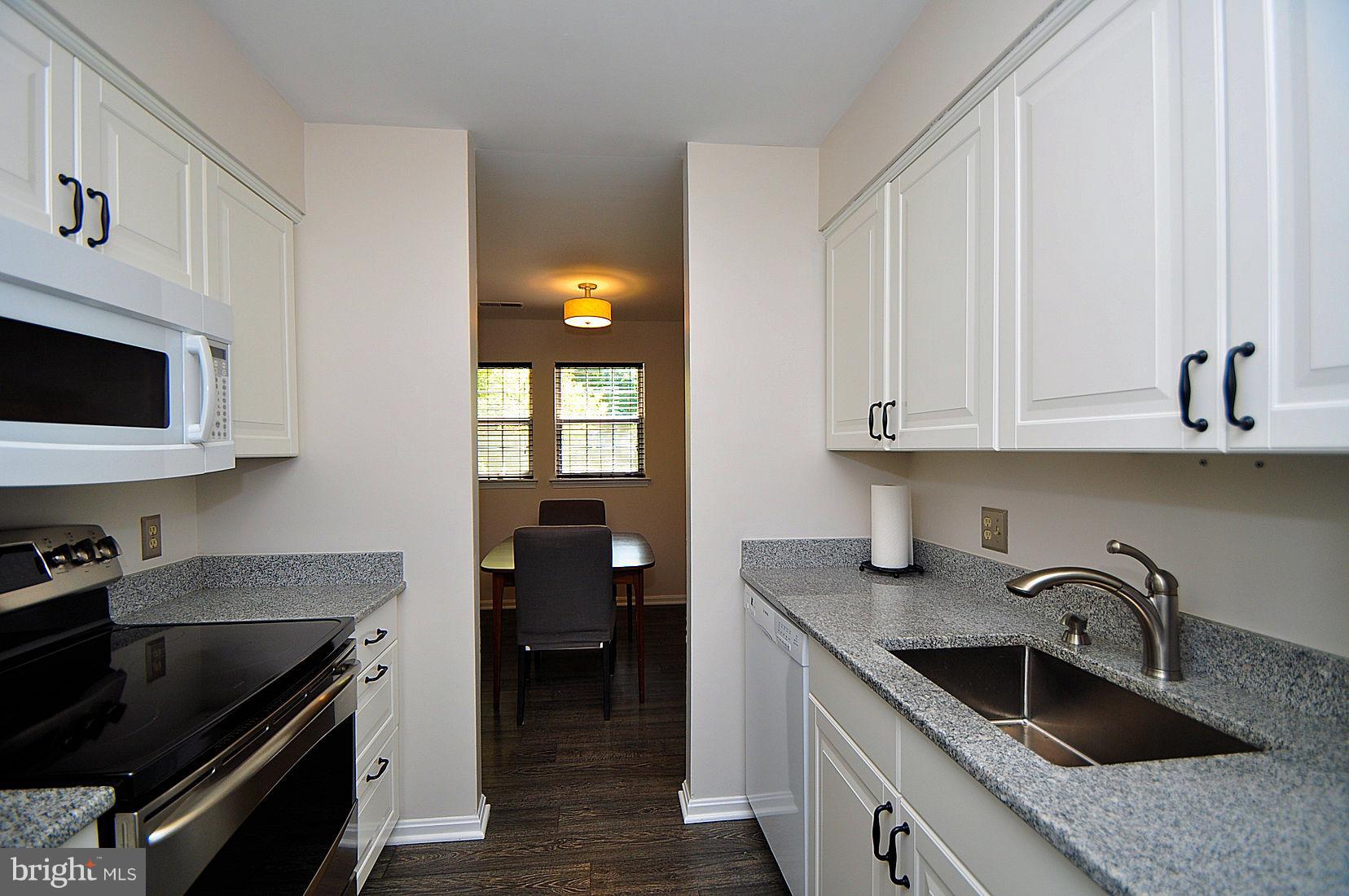 8399 Montgomery Run Road, Unit B Ellicott City, MD 21043 - Photo 4 of 22 Updated kitchen looking into dining area