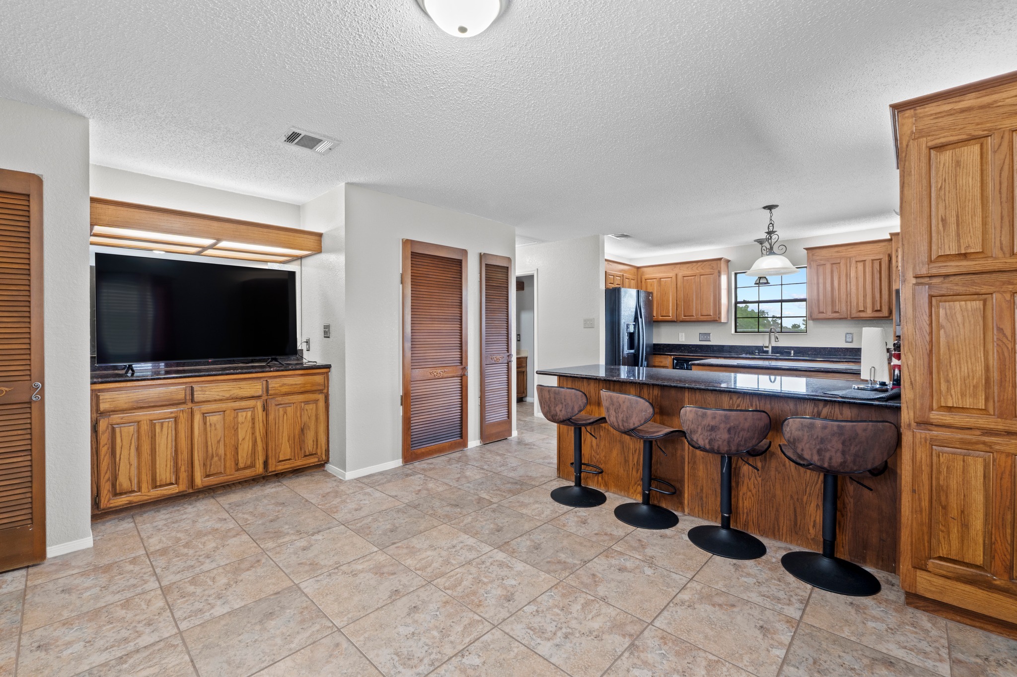 205 Sedro Trail Georgetown, TX 78633 - Photo 12 of 32 Functional kitchen with ample counter space and breakfast bar seating for casual dining.