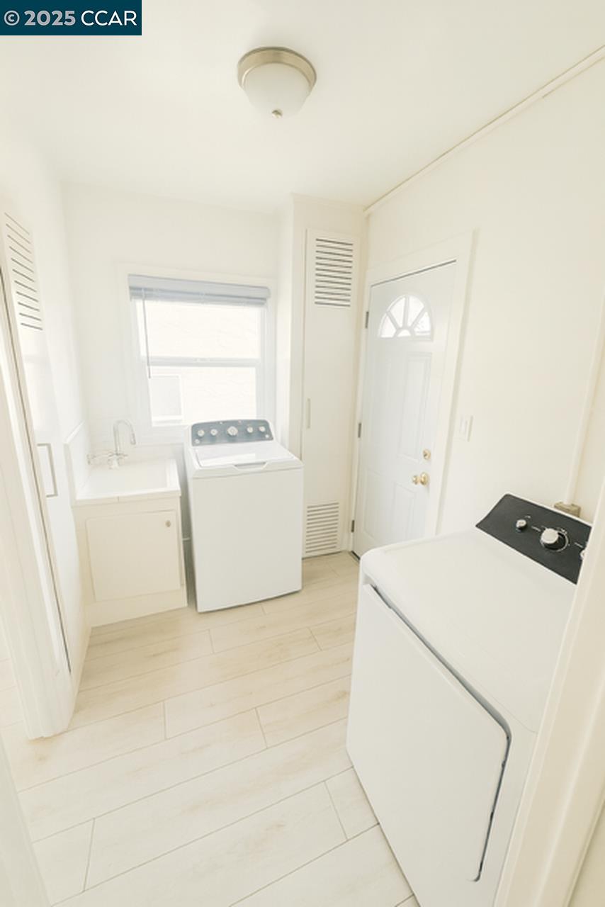 211 Second Street, Unit TOP Rodeo, CA 94572 - Photo 12 of 12 a utility room with dryer and washer