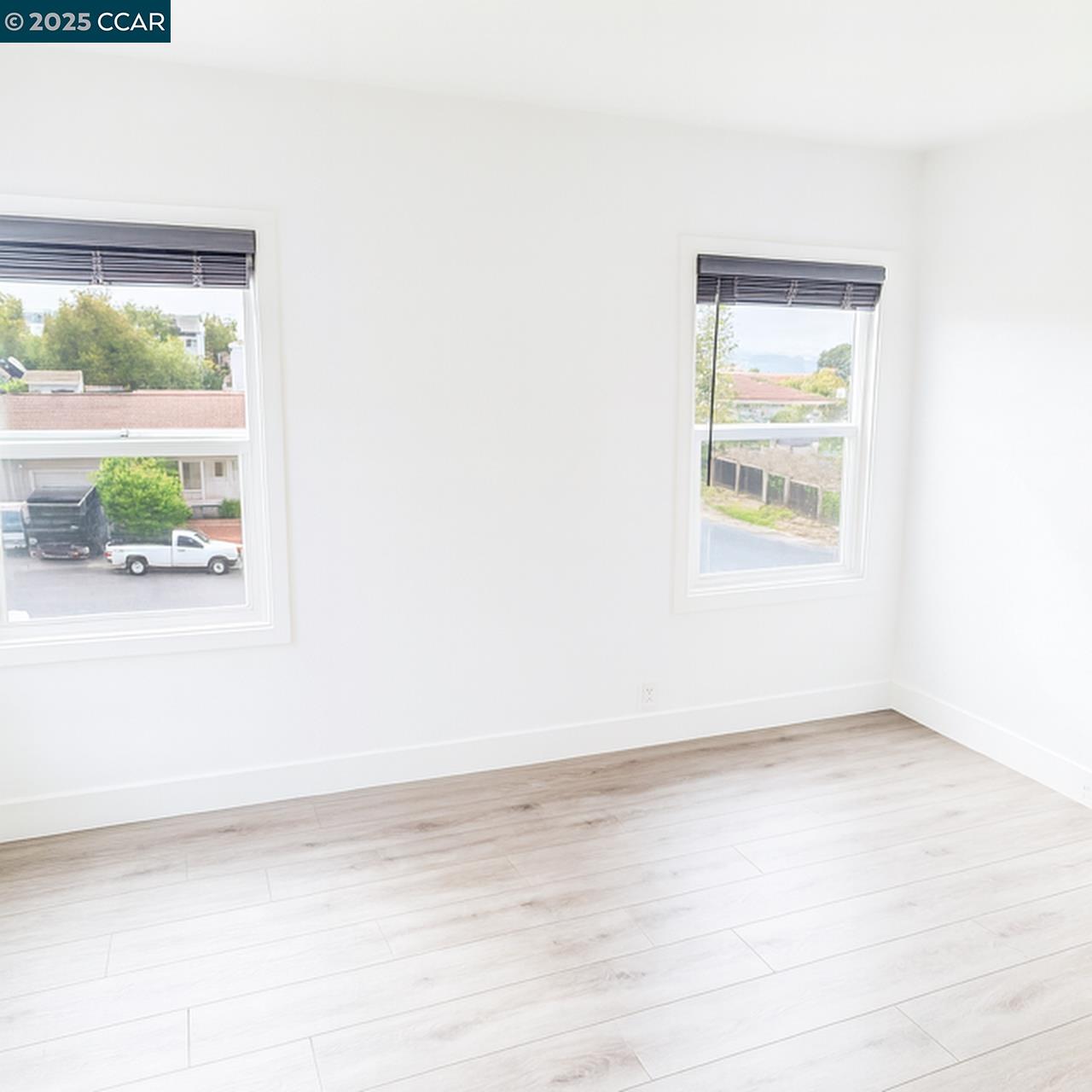 211 Second Street, Unit TOP Rodeo, CA 94572 - Photo 4 of 12 an empty room with a window
