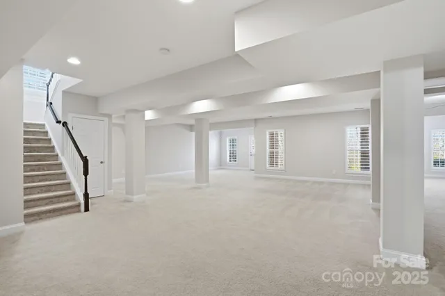 a view of an empty room with stairs