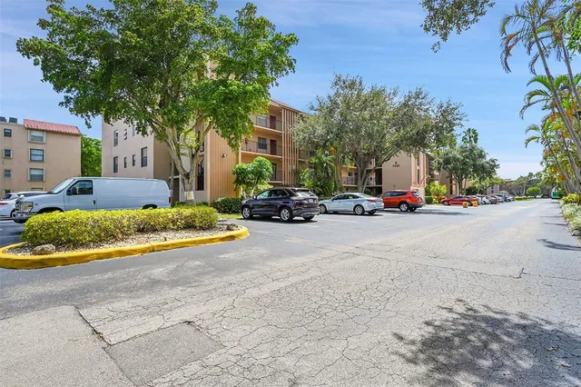a view of a street with cars on road