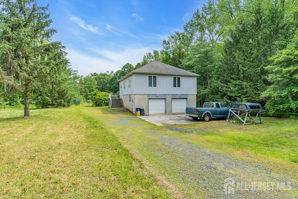 213 East Greystone Road Old Bridge, NJ 08857 - Photo 1 of 32 a view of a house with swimming pool and sitting area