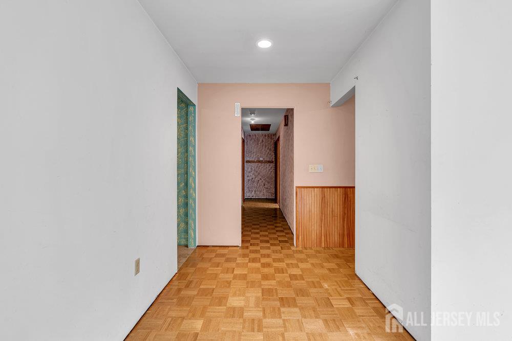 213 East Greystone Road Old Bridge, NJ 08857 - Photo 22 of 32 a view of a hallway with wooden shelves